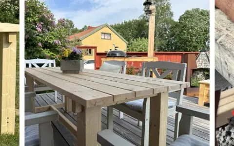 Bygga utebord: En person mäter trä för att bygga ett robust utomhusbord. Ett färdigt bord står på en altan med blommor och hus i bakgrunden.