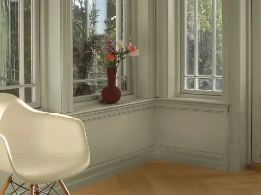 En ljus hall med en vit stol och en vas med blommor på fönsterbrädan. Väggarna är nymålade i en lugn grön nyans.
