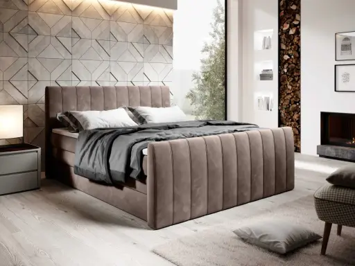En lyxig kontinentalsäng med förvaring i sammet, med en modern vägg bakom och en mysig brasa i en öppen spis.
